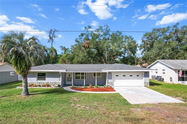 single story home featuring a front yard and a garage