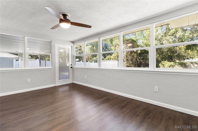 unfurnished sunroom featuring plenty of natural light and ceiling fan