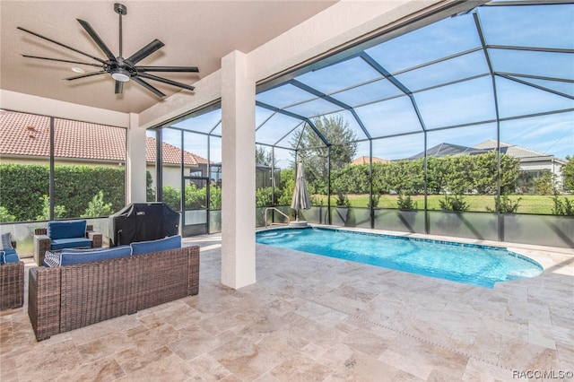 view of swimming pool featuring an outdoor hangout area, a patio area, ceiling fan, and a lanai