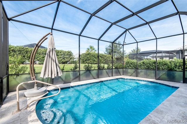 view of pool featuring a patio area and a lanai