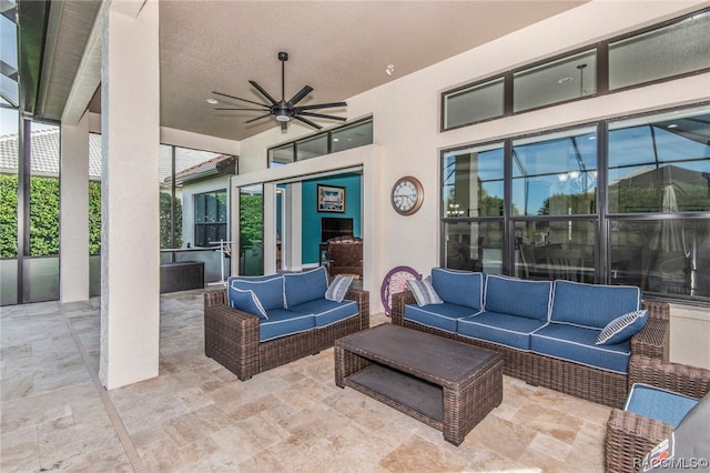 view of patio with outdoor lounge area and ceiling fan