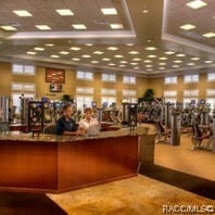 gym featuring a tray ceiling