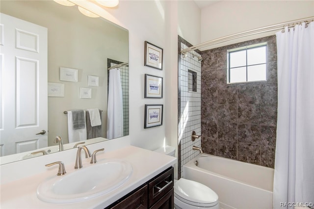 full bathroom with shower / bath combination with curtain, vanity, and toilet