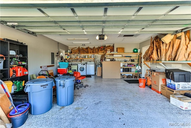 garage with washing machine and clothes dryer