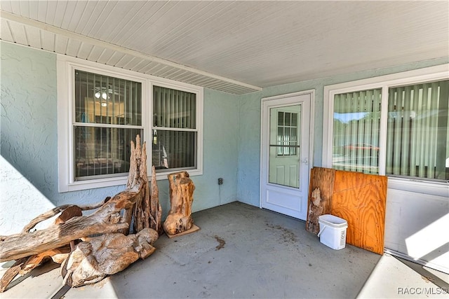 property entrance with stucco siding