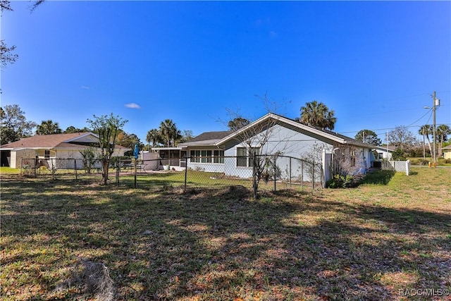 rear view of property with a yard and fence private yard