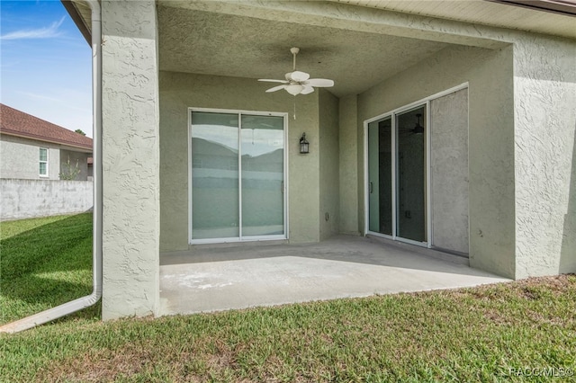 exterior space with ceiling fan