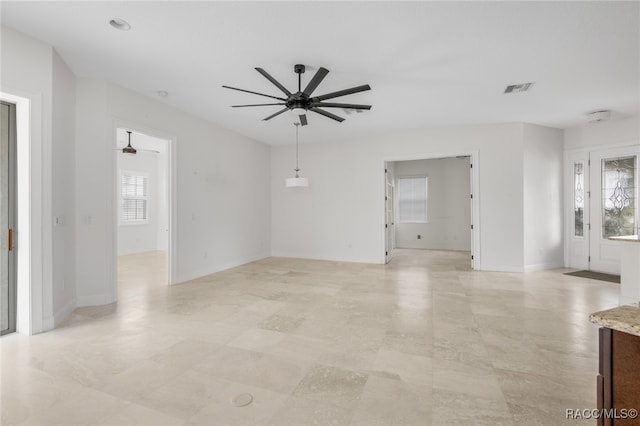 unfurnished room featuring ceiling fan