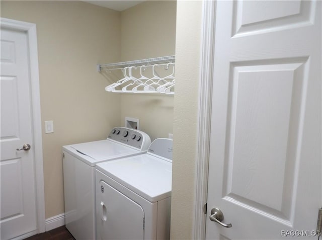 clothes washing area with independent washer and dryer