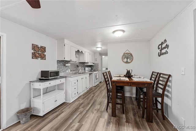 dining area with wood finished floors