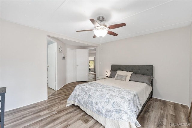 bedroom with ceiling fan and wood finished floors