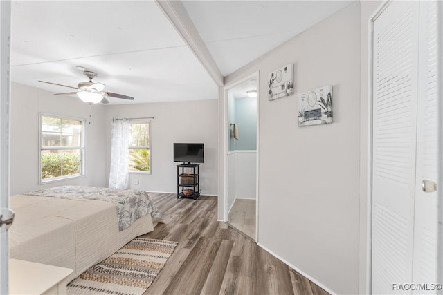 bedroom with ceiling fan and wood finished floors