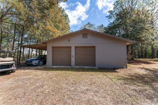 garage featuring a detached garage