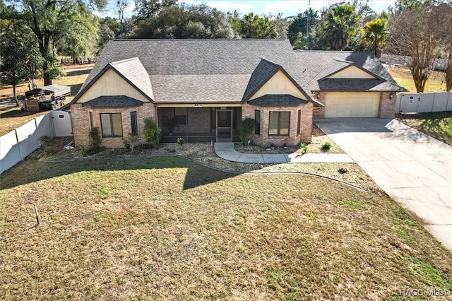 view of front facade with a garage and a front lawn