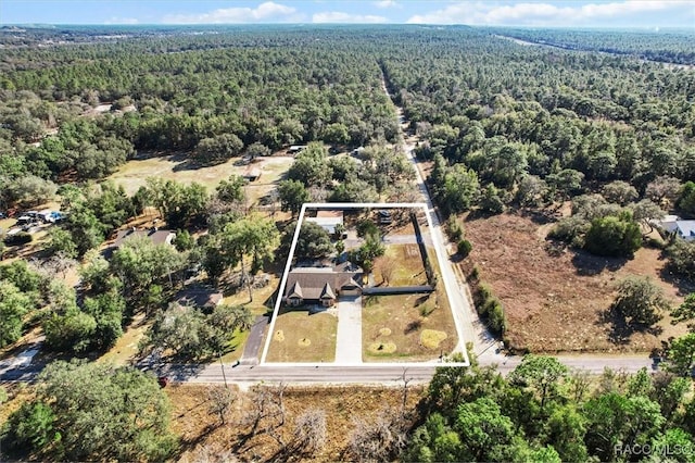 aerial view featuring a view of trees