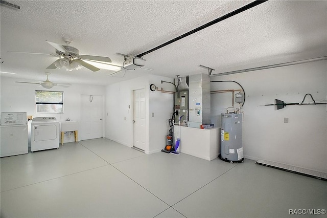 garage with ceiling fan, sink, separate washer and dryer, water heater, and a garage door opener