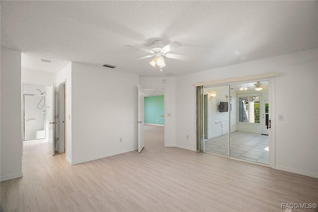 unfurnished bedroom featuring a textured ceiling, light hardwood / wood-style floors, and ceiling fan