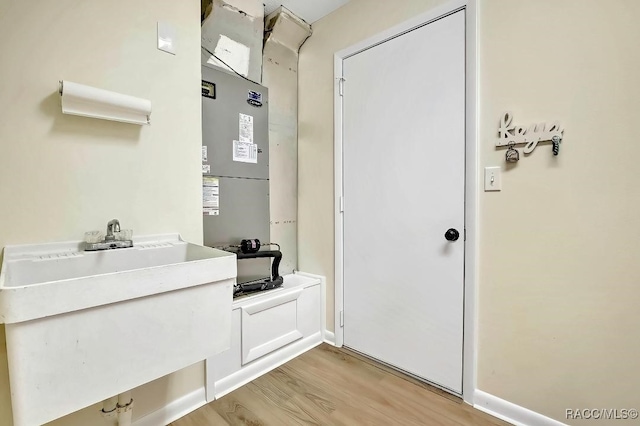 bathroom with sink and wood-type flooring