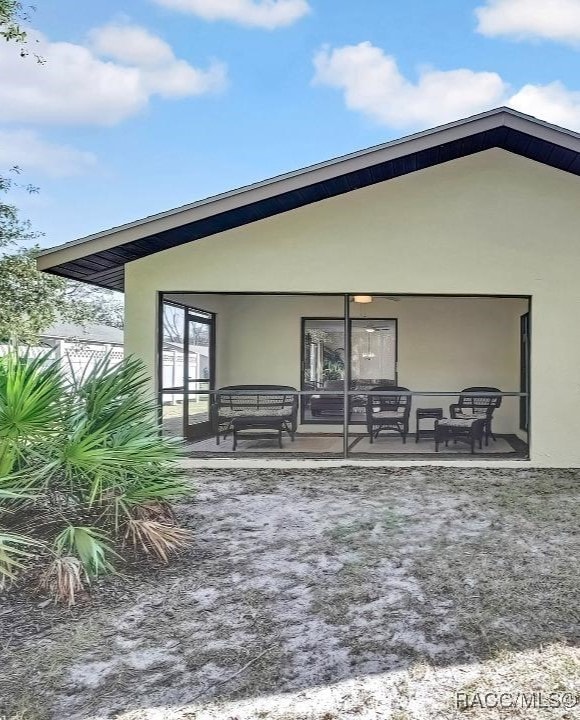 back of house with a patio