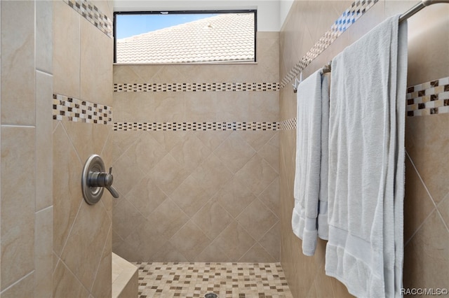 bathroom with tiled shower