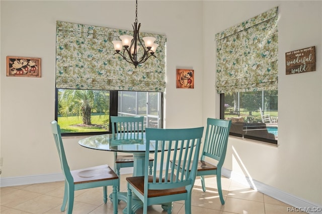 tiled dining area with an inviting chandelier