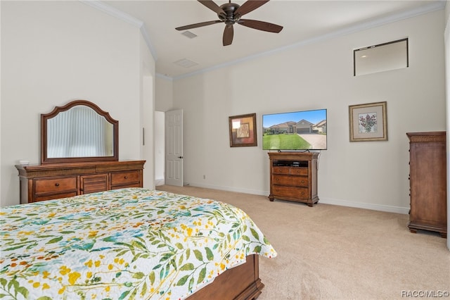 carpeted bedroom with ceiling fan and ornamental molding