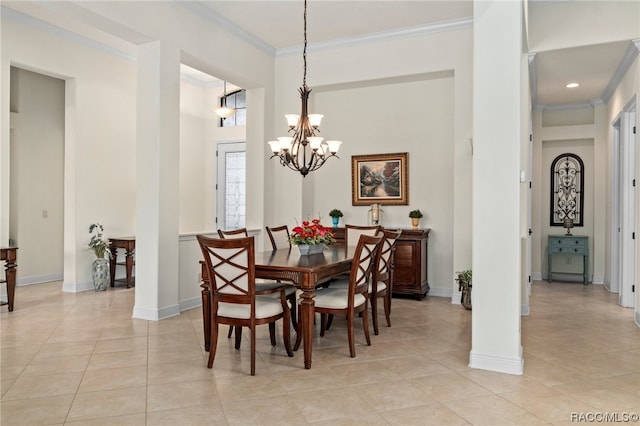 dining room featuring light tile patterned floors, crown molding, and a chandelier