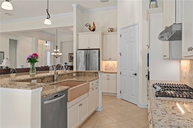 kitchen featuring exhaust hood, white cabinetry, hanging light fixtures, and stainless steel appliances