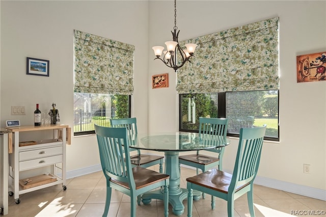 dining room featuring a notable chandelier and light tile patterned floors