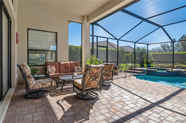 view of patio featuring outdoor lounge area, glass enclosure, and a pool with hot tub