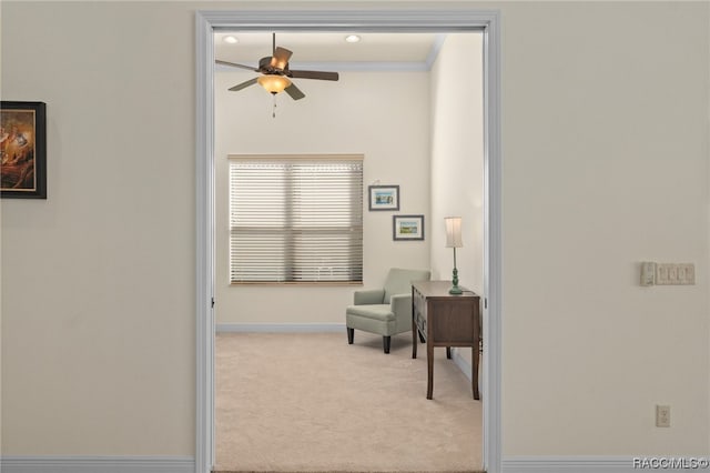 interior space featuring ornamental molding and light carpet