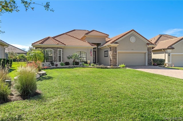 mediterranean / spanish-style house with a garage and a front yard