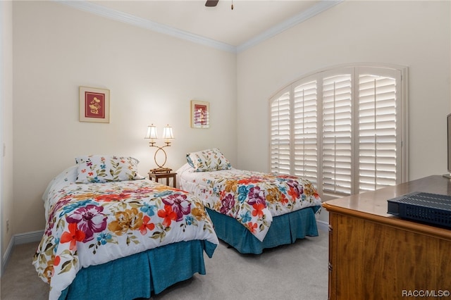 carpeted bedroom with ceiling fan and crown molding