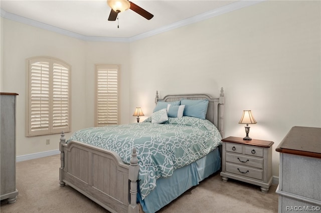 bedroom with ceiling fan, crown molding, and light colored carpet