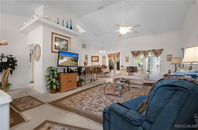living area featuring ceiling fan, visible vents, carpet, and high vaulted ceiling