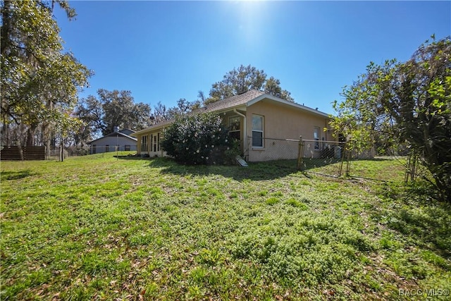 view of yard featuring fence