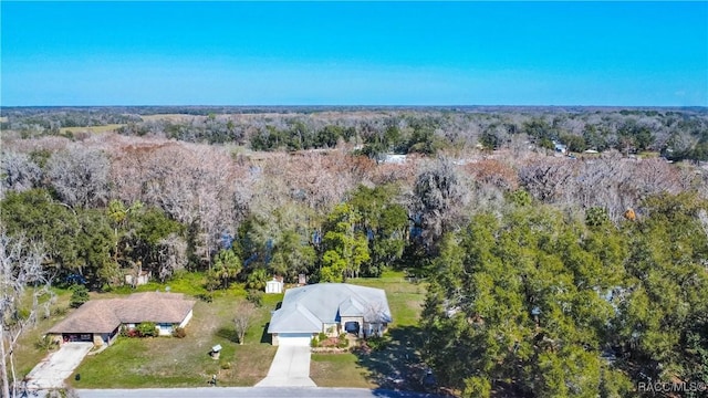 aerial view with a wooded view