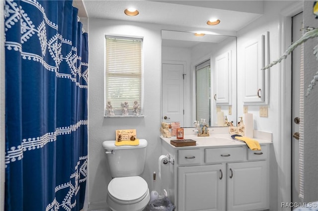 bathroom with recessed lighting, vanity, toilet, and a shower with shower curtain