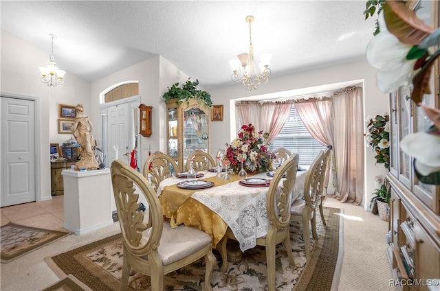 dining area with a notable chandelier and light carpet