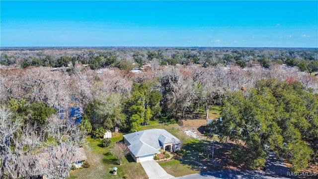 drone / aerial view featuring a view of trees