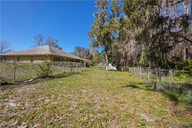 view of yard with a fenced backyard