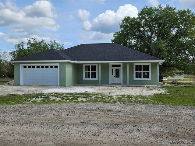 view of front of property with a garage