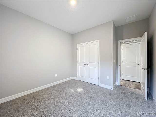 unfurnished bedroom featuring a closet