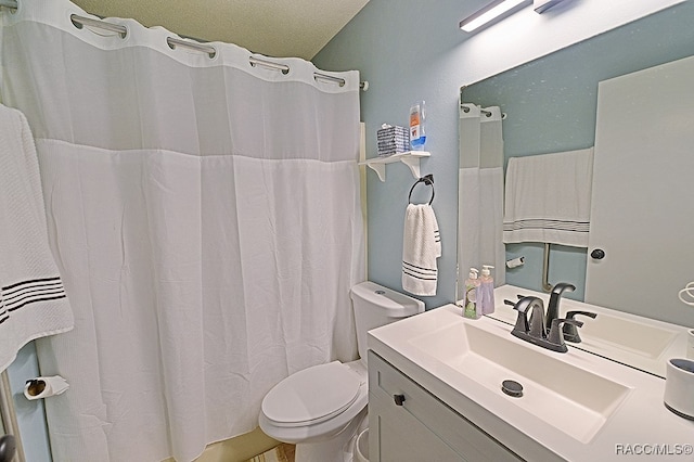 bathroom featuring vanity, toilet, and walk in shower