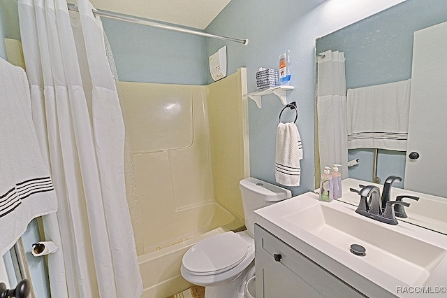 full bathroom with vanity, shower / bath combination with curtain, and toilet