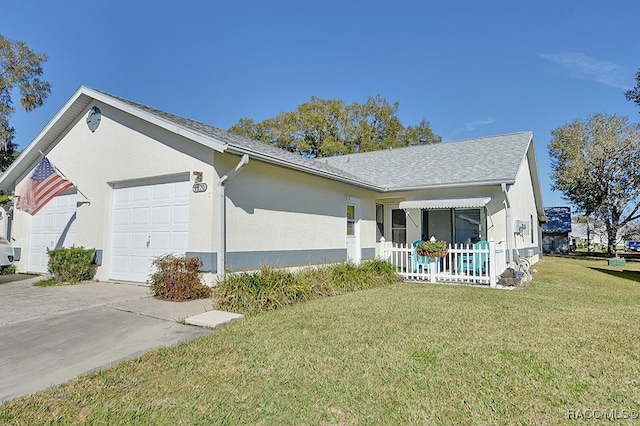 ranch-style home with a front yard and a garage