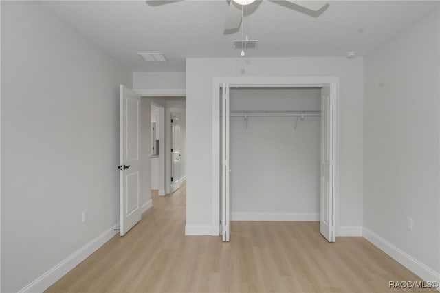 unfurnished bedroom with ceiling fan, light hardwood / wood-style floors, and a closet