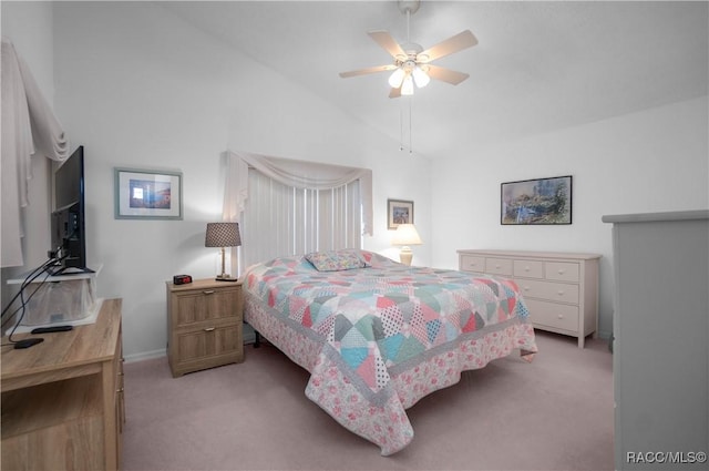 bedroom with ceiling fan, light colored carpet, and vaulted ceiling