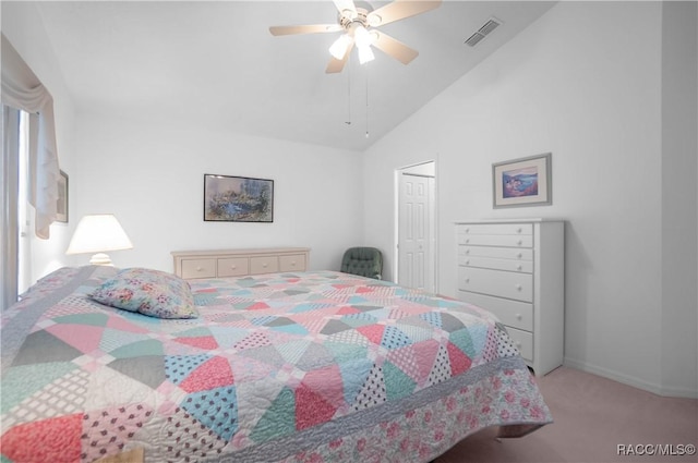 bedroom featuring high vaulted ceiling, light colored carpet, a closet, and ceiling fan