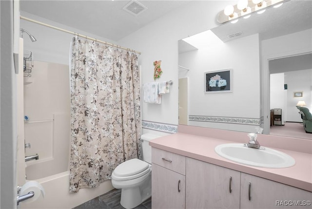 full bathroom featuring vanity, toilet, and shower / bath combo